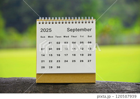 September 2025 white calendar with green blurred background - New year concept September 2025 white calendar with green blurred background - New year concept 120587939