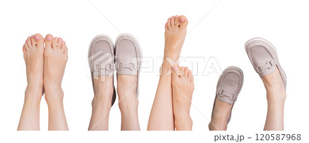 Bare feet next to stylish beige leather loafers with chic chain decor. Modern slip on design 120587968