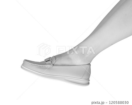 Feet in stylish leather loafers, a chic and comfortable pair of slip on shoes. Elegant, modern 120588030