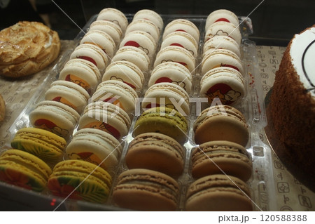 Macaron cake rows in the window of the store's cafe. Traditional desserts 120588388