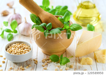 Pesto sauce cooking. Italian basil pesto sauce with culinary ingredients for cooking. 120589950