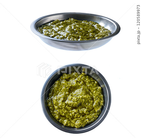 sauce pesto in a stainless steel bowl isolated on white background. sauce pesto in a stainless steel bowl isolated on white background. 120589973