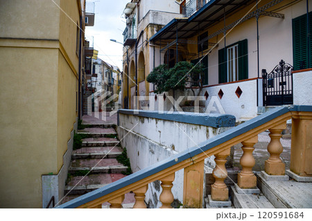 A beautifully constructed set of stairs leading up to a tall building 120591684
