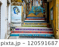 A vibrant set of colorful stairs decorated with welcoming street arts 120591687