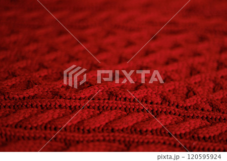A close up of a red knit sweater 120595924
