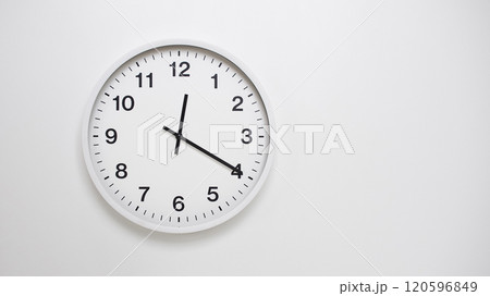 Clean White Clock at 12.20 or 00.20 on Minimalist White Background - Ideal for Time Concepts and Modern Design Clean White Clock at 12.20 or 00.20 on Minimalist White Background - Ideal for Time Concepts and Modern Design 120596849