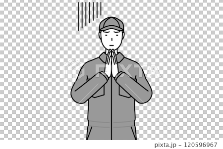 体の前で手を合わせて謝るつなぎ姿の整備士 120596967