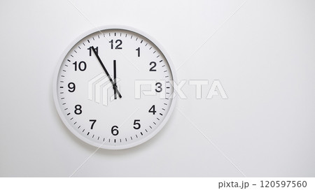 Clean White Clock at 11.55 or 23.55 on Minimalist White Background - Ideal for Time Concepts and Modern Design Clean White Clock at 11.55 or 23.55 on Minimalist White Background - Ideal for Time Concepts and Modern Design 120597560