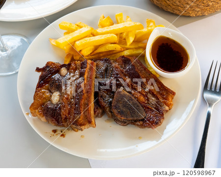 Portion of fried potatoes with beef steak Portion of fried potatoes with beef steak 120598967
