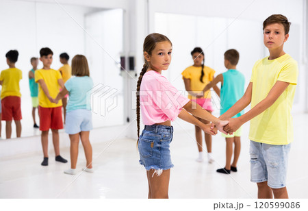 Boys and girls enjoying active dance in studio 120599086
