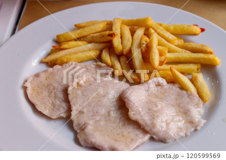 Tasty fried scallops with french fries on a plate 120599569