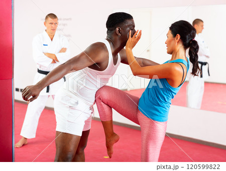 Self-defense lesson for women in gym. Defense training 120599822