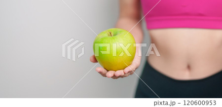 woman hand hold green Apple and donut, female fitness choose between fruit is Healthy and sweet is Unhealthy junk food. Dieting control, Weight loss, Obesity, eating lifestyle and nutrition concept woman hand hold green Apple and donut, female fitness choose between fruit is Healthy and sweet is Unhealthy junk food. Dieting control, Weight loss, Obesity, eating lifestyle and nutrition concept 120600953