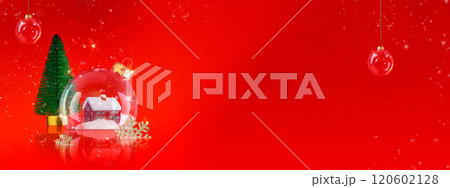 Christmas festive snow globe with house and fir tree. Happy New Year and Merry Christmas. Christmas transparent baubles and fir tree on red background with sparkling lights and snowflakes 120602128
