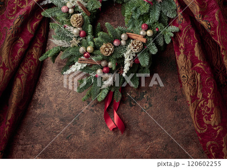 Christmas wreath on a brown vintage background. 120602255