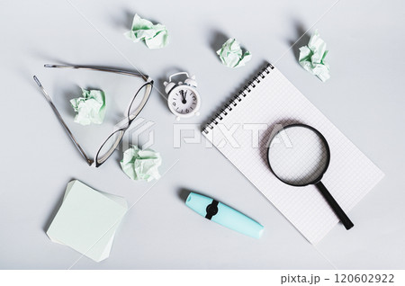 Burnout break concept. Notebook, glasses and alarm clock on the desk top view Burnout break concept. Notebook, glasses and alarm clock on the desk top view 120602922