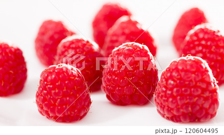 Handful of raspberry berries on white background Handful of raspberry berries on white background 120604495