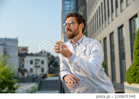 Ginger young doctor having morning coffee after a night shift Ginger young doctor having morning coffee after a night shift 120605348