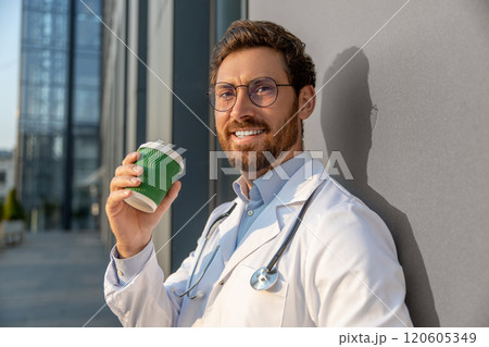 Ginger young doctor having morning coffee after a night shift Ginger young doctor having morning coffee after a night shift 120605349