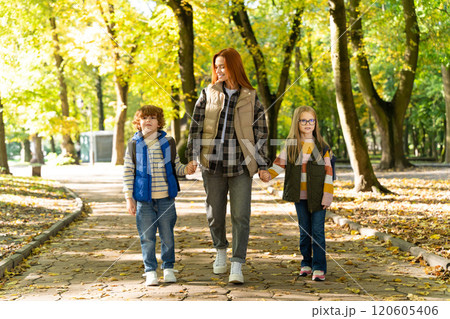 Friends resting in park embracing togetherness and sustainable lifestyle through outdoor activities 120605406