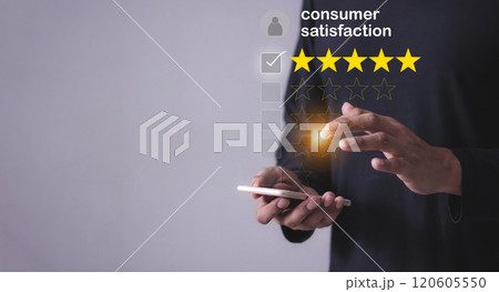 Consumer Satisfaction, Young Man hand uses smartphone mobile with five star to review and give 5star 120605550