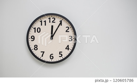 Classic Black-Edged Clock on White Background at 12.05/00.05 - Perfect for Time Management and Text Space 120605786