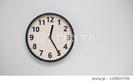 Classic Black-Edged Clock on White Background at 12.25/00.25 - Perfect for Time Management and Text Space Classic Black-Edged Clock on White Background at 12.25/00.25 - Perfect for Time Management and Text Space 120605790