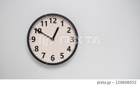 Classic Black-Edged Clock on White Background at 12.50/00.50 - Perfect for Time Management and Text Space Classic Black-Edged Clock on White Background at 12.50/00.50 - Perfect for Time Management and Text Space 120606052