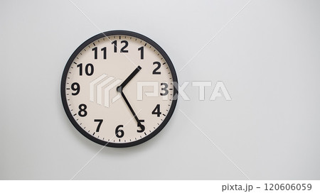Classic Black-Edged Clock on White Background at 13.25/01.25 - Perfect for Time Management and Text Space Classic Black-Edged Clock on White Background at 13.25/01.25 - Perfect for Time Management and Text Space 120606059