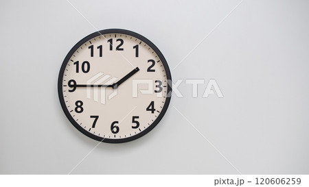 Classic Black-Edged Clock on White Background at 13.45/01.45 - Perfect for Time Management and Text Space Classic Black-Edged Clock on White Background at 13.45/01.45 - Perfect for Time Management and Text Space 120606259