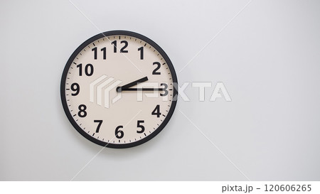 Classic Black-Edged Clock on White Background at 14.15/02.15 - Perfect for Time Management and Text Space 120606265