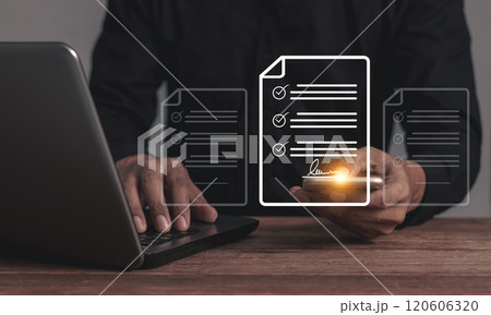 Young man with laptop hand touching smartphone musinessobile to sign a business contract online Young man with laptop hand touching smartphone musinessobile to sign a business contract online 120606320