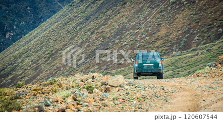 Prepared off road car on arid rock mountain trail, Copy space. Traveling by auto, adventure in wildlife, expedition or extreme travel on 4x4 automobile. 120607544