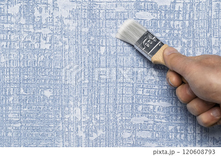 HandPainting a Beautifully Textured Blue Wallpaper Using a Brush for Adding Charm 120608793