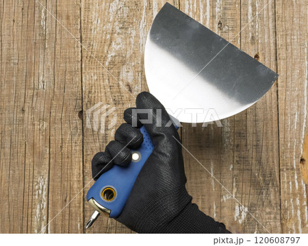 Stainless Steel Trowel with a Black Handle specifically designed for Home Improvement tasks Stainless Steel Trowel with a Black Handle specifically designed for Home Improvement tasks 120608797