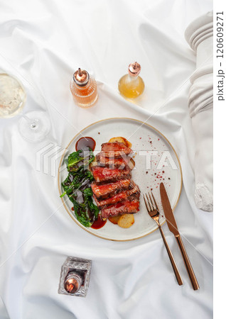 Beef Steak with Confit Potatoes and Spinach 120609271