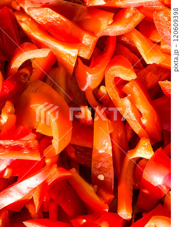 Red fresh bell pepper, sliced. Top view of red cut pepper background. Healthy food concept. 120609398