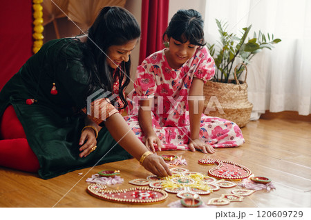 Enjoying Diwali Together Creating Rangoli Designs 120609729