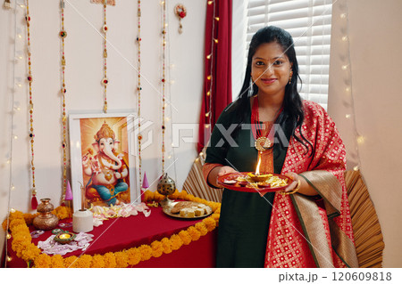Celebrating Ganesh Chaturthi in Home Setting Celebrating Ganesh Chaturthi in Home Setting 120609818