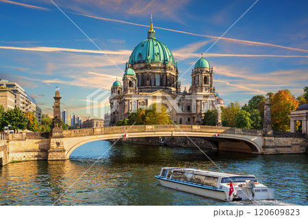 Cruise Ship is sailing near the Attractive cathedral or Berliner Dom on Museum Island, Berlin, Germany 120609823