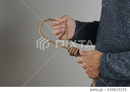 man holds a rope with a noose 120613235