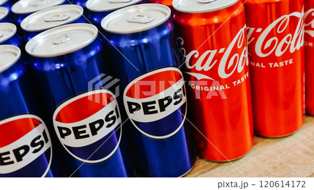 Kyiv, Ukraine - November 5, 2024: Close-up of neatly arranged Pepsi and Coca-Cola cans, showcasing a vibrant contrast of their iconic blue and red branding Kyiv, Ukraine - November 5, 2024: Close-up of neatly arranged Pepsi and Coca-Cola cans, showcasing a vibrant contrast of their iconic blue and red branding 120614172