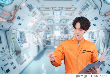 宇宙ステーションの中で働く若い男性の宇宙飛行士 宇宙ステーションの中で働く若い男性の宇宙飛行士 120615866