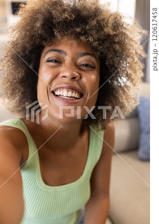 On video call, Smiling woman, at home 120617458