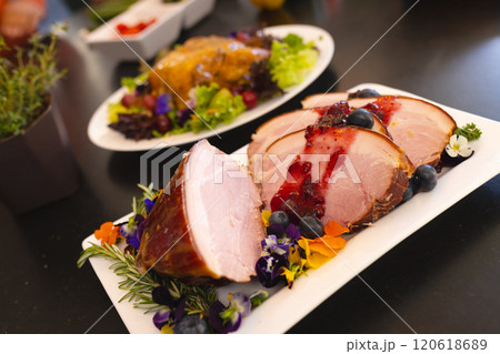 Delicious meal prepared for christmas dinner, on table in sunny dining room Delicious meal prepared for christmas dinner, on table in sunny dining room 120618689