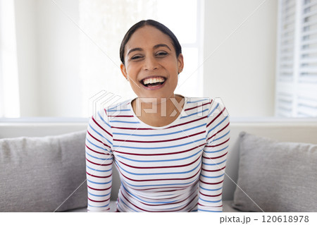 Portrait of happy biracial woman having video call at home Portrait of happy biracial woman having video call at home 120618978