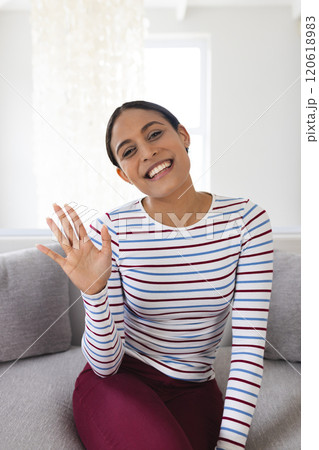 Portrait of happy biracial woman having video call at home Portrait of happy biracial woman having video call at home 120618983