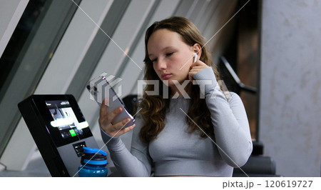 Teen girl tired in the gym. Teenage girl taking a break from boxing in gym Teen girl tired in the gym. Teenage girl taking a break from boxing in gym 120619727
