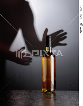 Bottle of white wine on a black table. 120620290