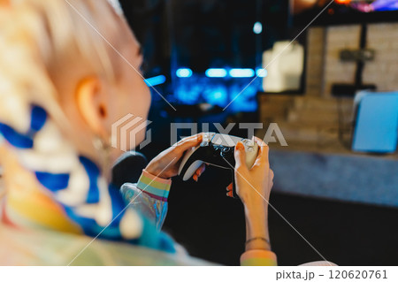 Engaging in an exciting gaming session at a modern entertainment venue 120620761